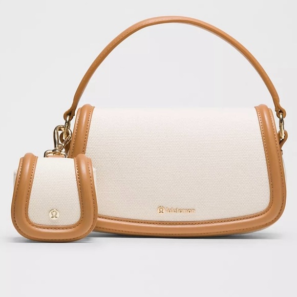 lululemon athletica Handbags - NWT lululemon athletica Canvas Mini Bag 🔥🔥💰💰I have three of these if needed..